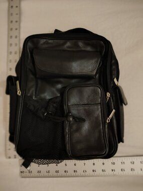 1990's vintage Wilson's leather backpack with several pockets for sunglasses, ph